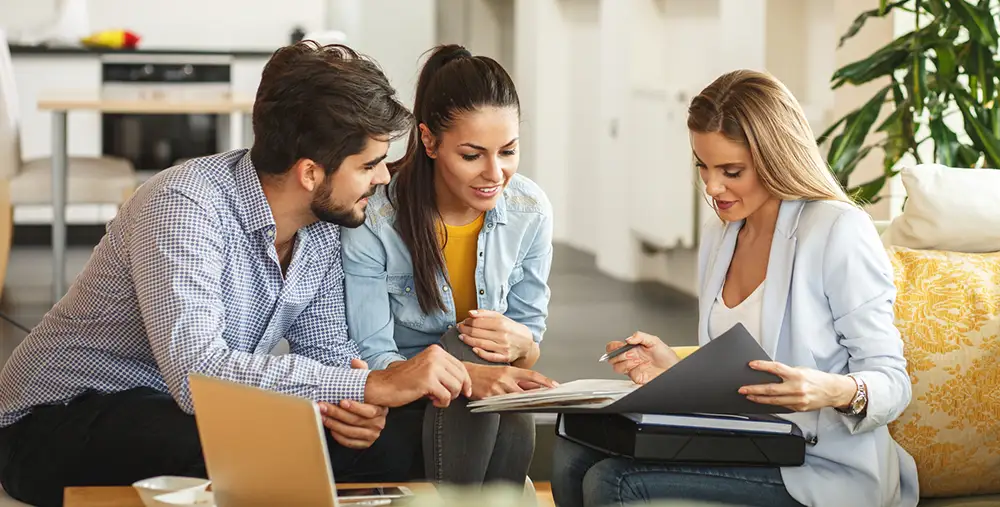 couple meeting with their insurance agent