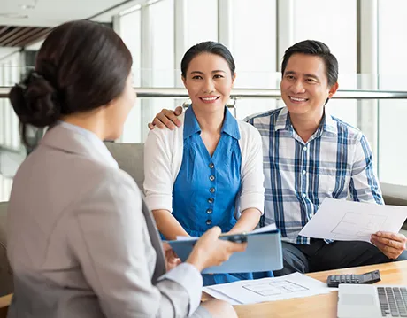 couple talking with insurance agent