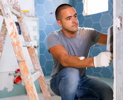 photo of a contractor laying tile