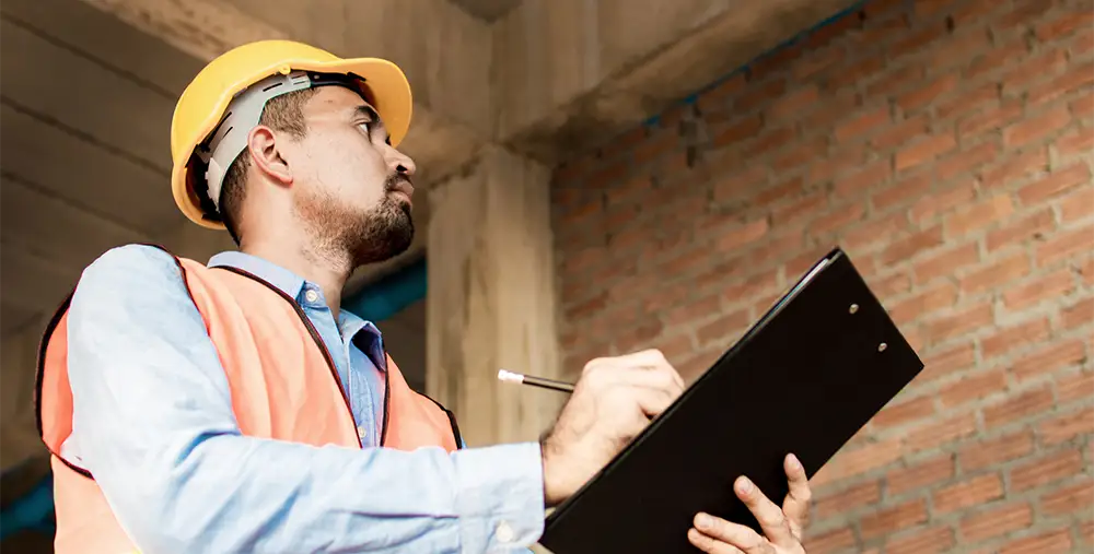 home inspector taking notes on a clipboard