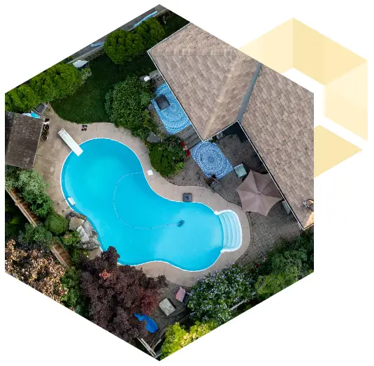 aerial photo of an in-ground swimming pool in a backyard
